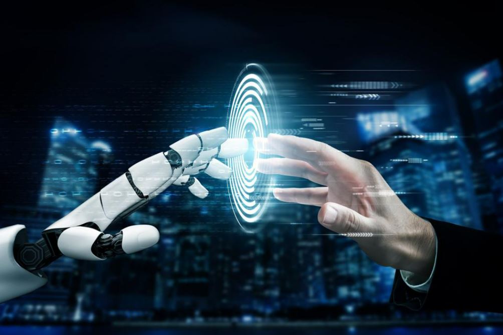 3 Ways That Artificial Intelligence (AI) Will Change Your Job Forever - robot and human hand touching