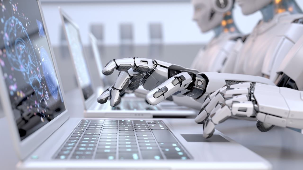 AI creates more jobs - robot uses computer